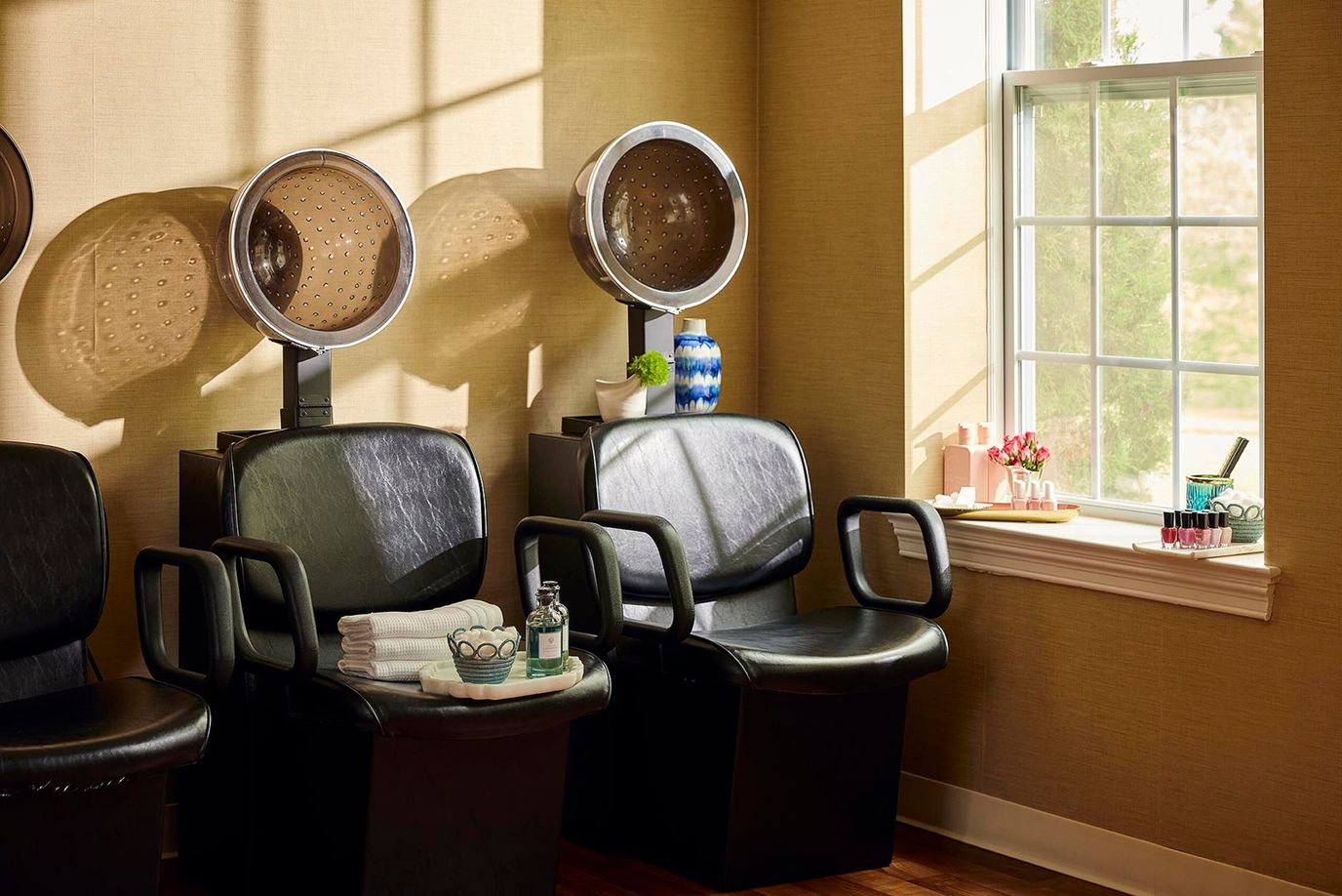 Hair salon area with styling chairs and light.