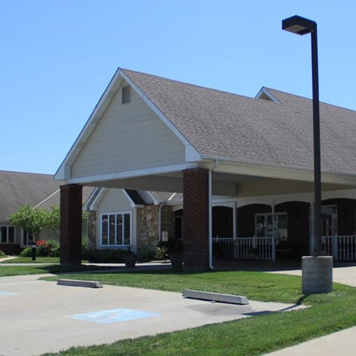 Vintage Park at Kansas, assisted living — Senior living facility entrance with covered porch and landscaping