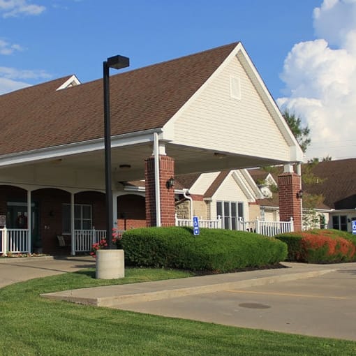 Vintage Park at Kansas, assisted living — Front entrance of a senior living facility with landscaping