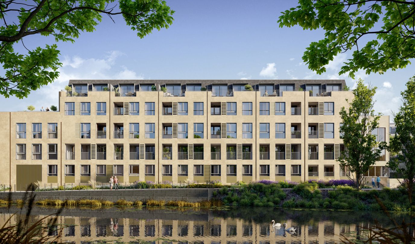 Modern assisted living facility by a pond.