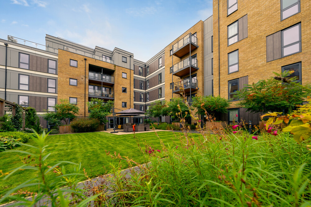 Outdoor view of landscaped courtyard and building.