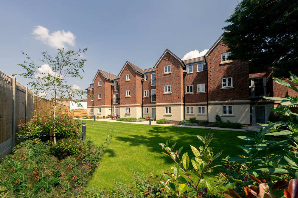 Exterior view of retirement living building and garden