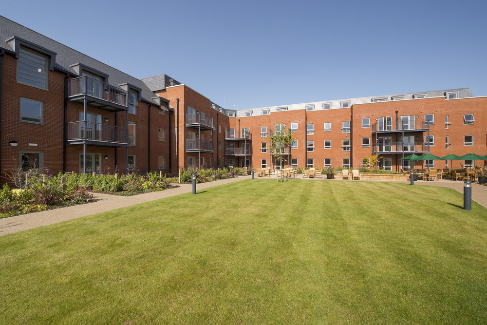 Well-maintained outdoor space with gardens and seating