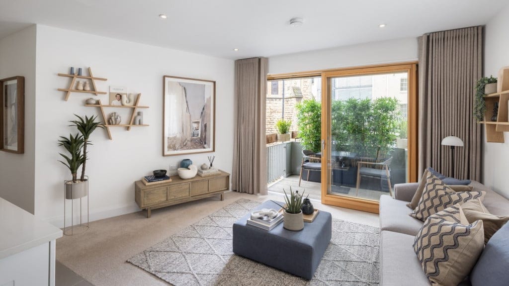 Bright and airy common area with plants and seating.