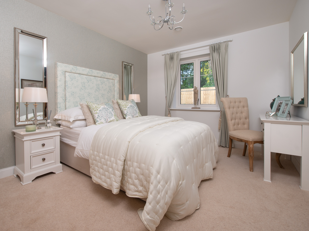 Cozy bedroom with a bed, chair, and stylish decor.