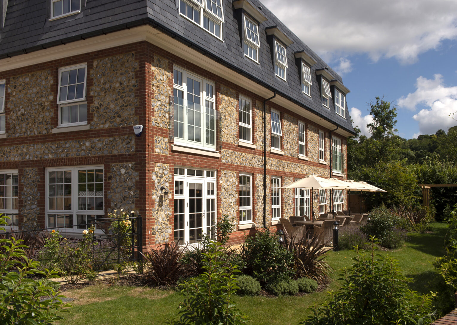 Exterior view of retirement living building with garden