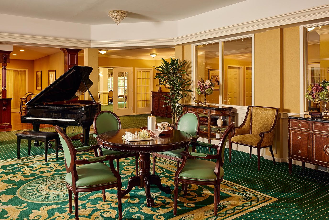 Interior view of a common area with piano and seating