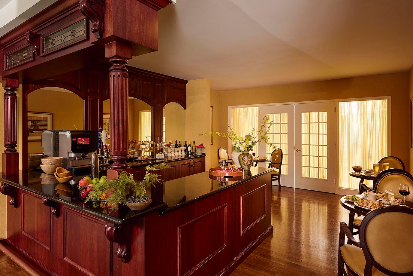 Interior view of a bar area with residents enjoying refreshments