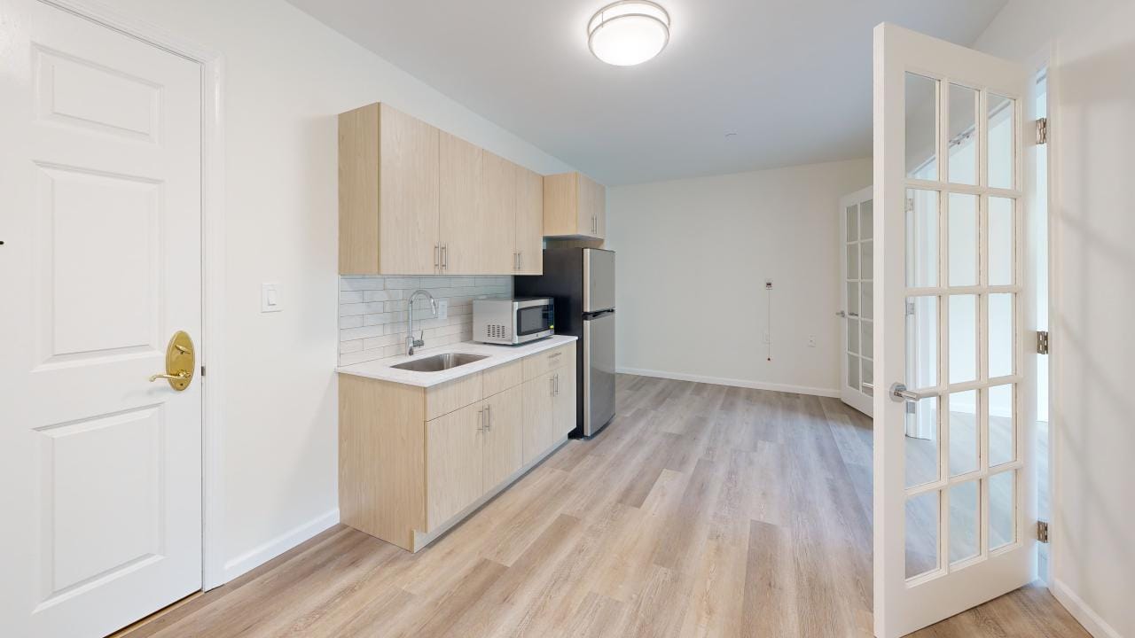 Bright, modern kitchen area in a resident room