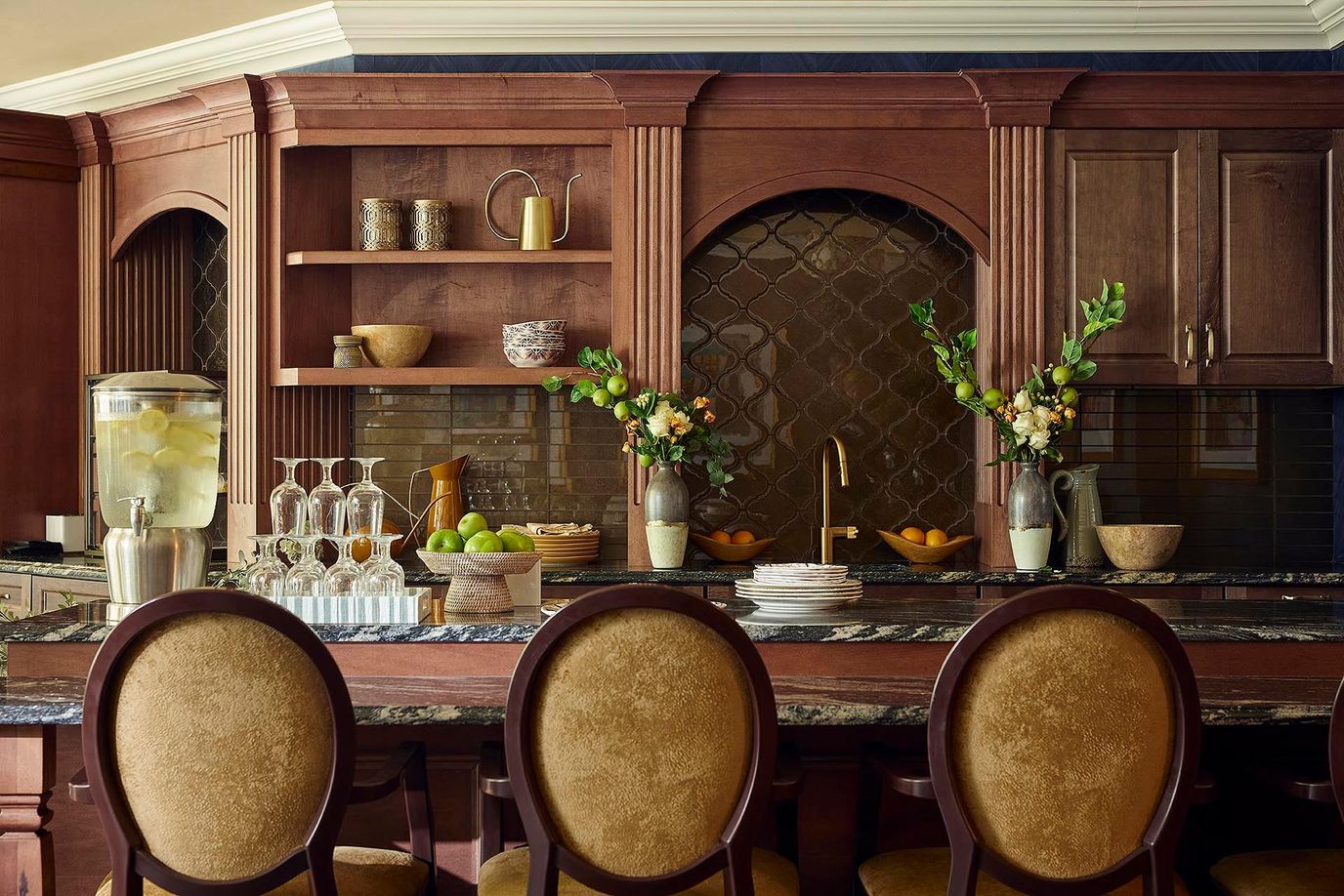 Elegant kitchen area with decorative elements and seating