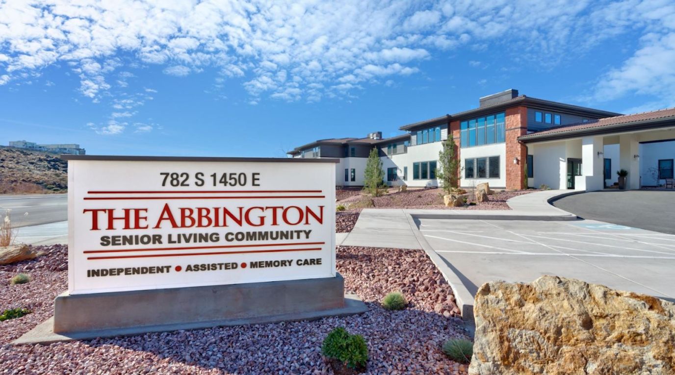 Exterior view of Abbington Senior Living Community sign and building