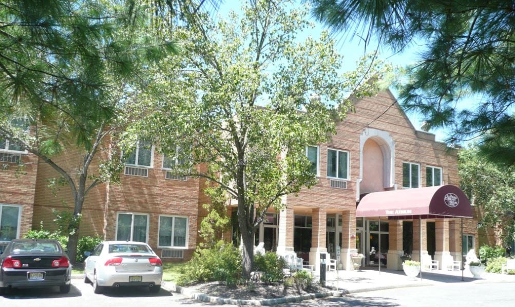 Exterior view of Allendale Senior Living with gardens