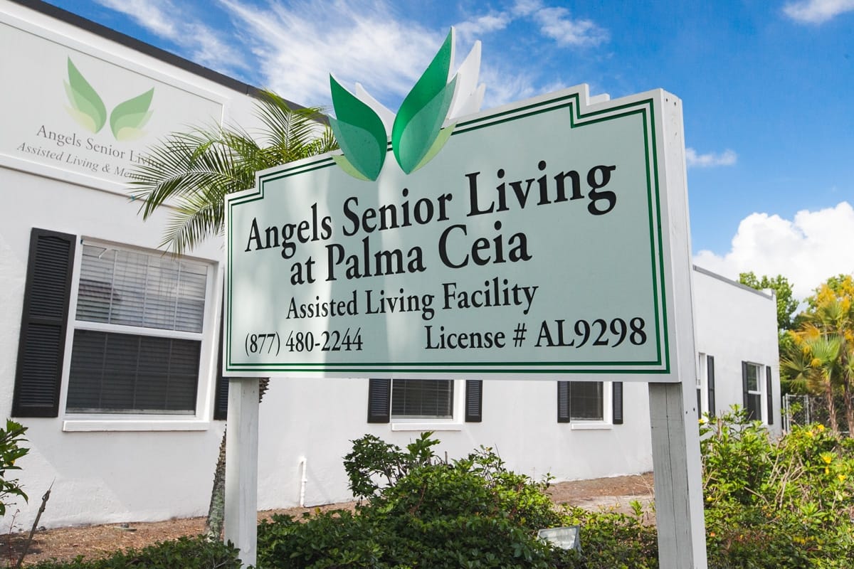Sign for Angels Senior Living at Palma Ceia with greenery