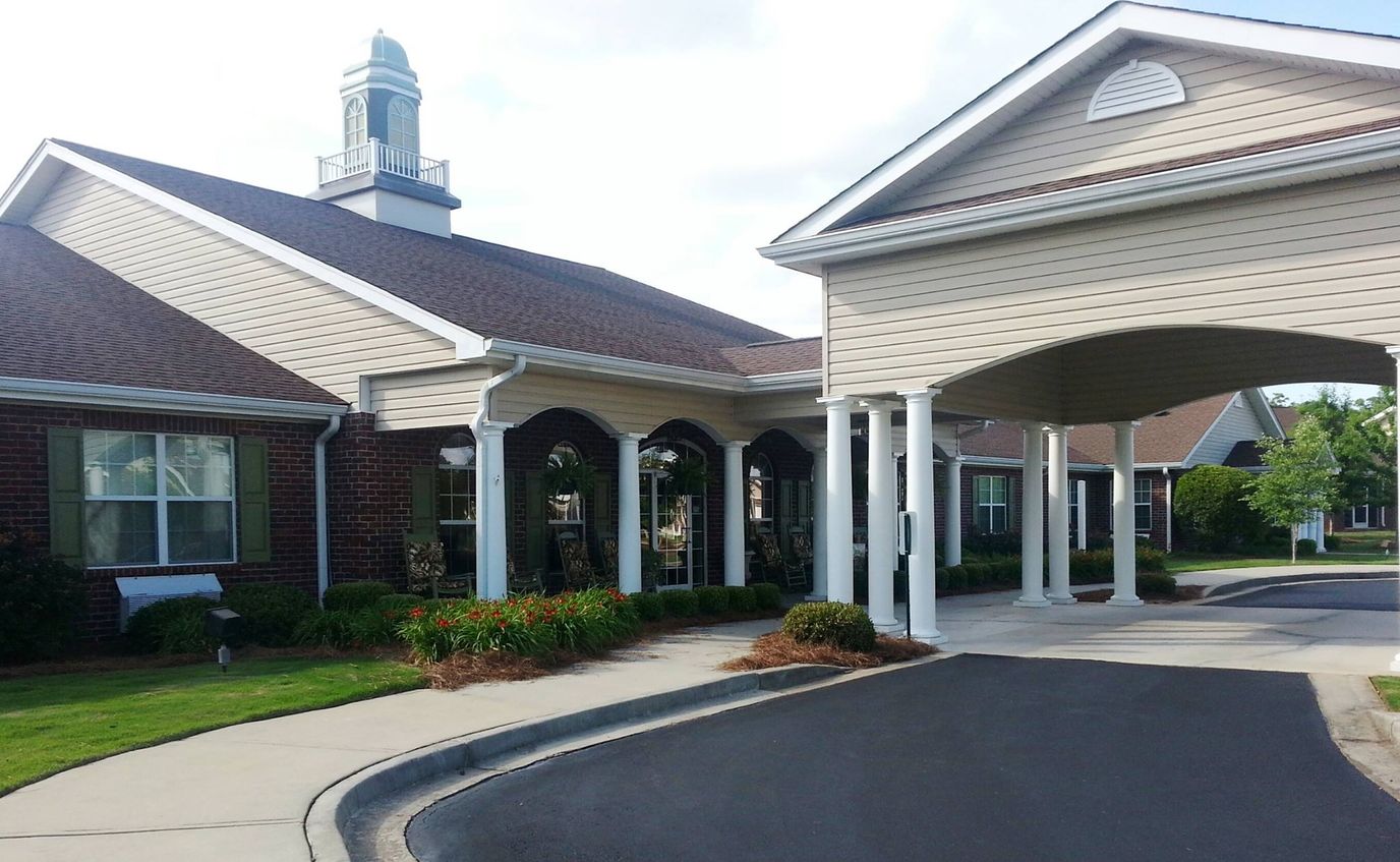 Building exterior with entrance and landscaping