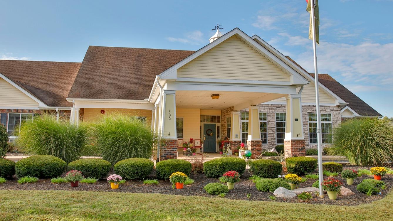 Exterior view of the senior living facility with landscaping