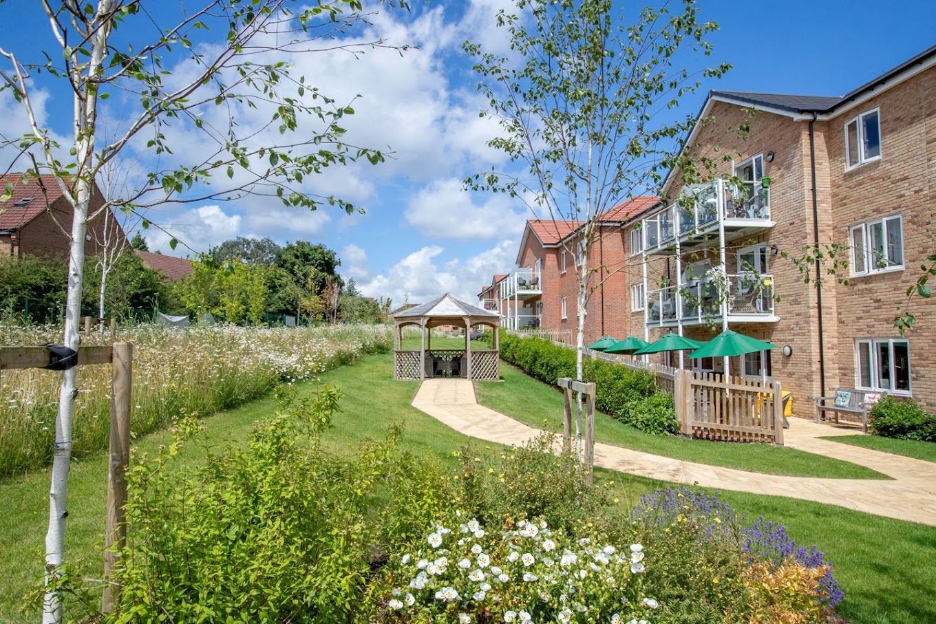 Outdoor space with gardens and building facade