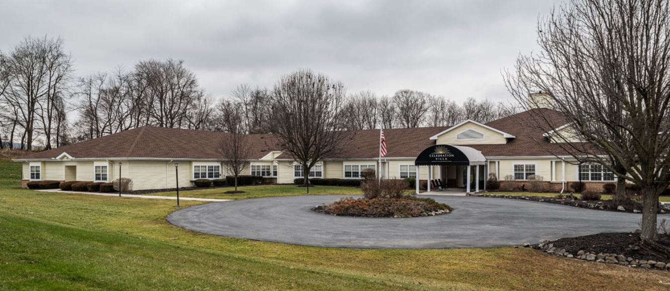Exterior view of Celebration Villa of Dillsburg with landscaped entrance
