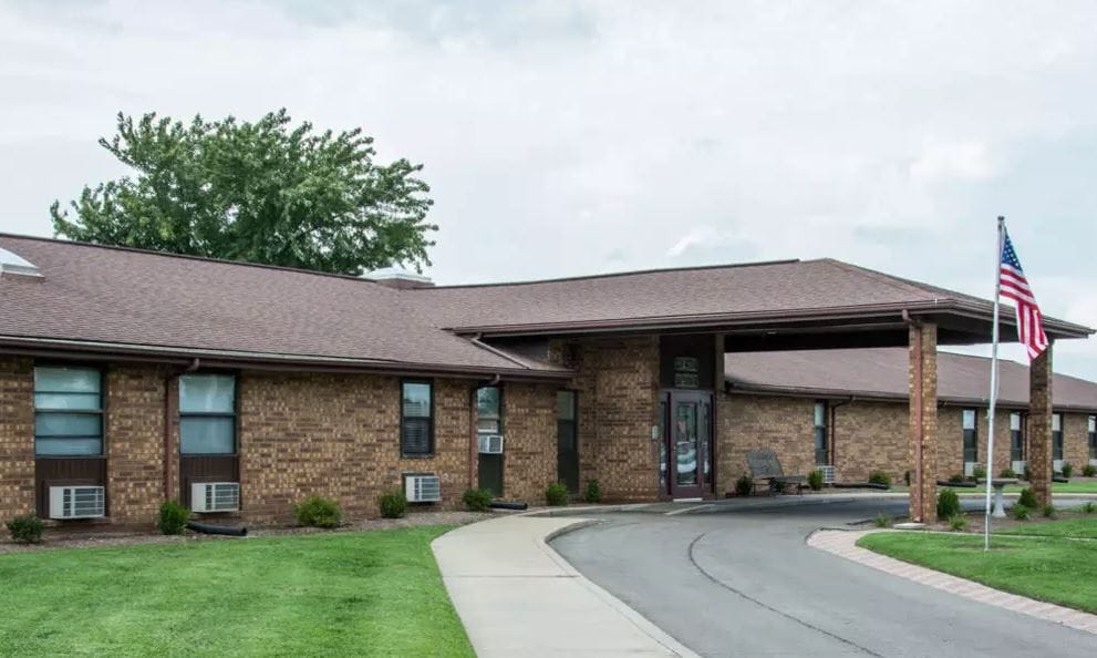 Exterior view of Chaffee Nursing Center with flag