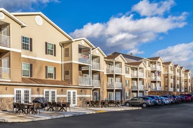 Exterior view of Connect55+ Pittston with outdoor seating