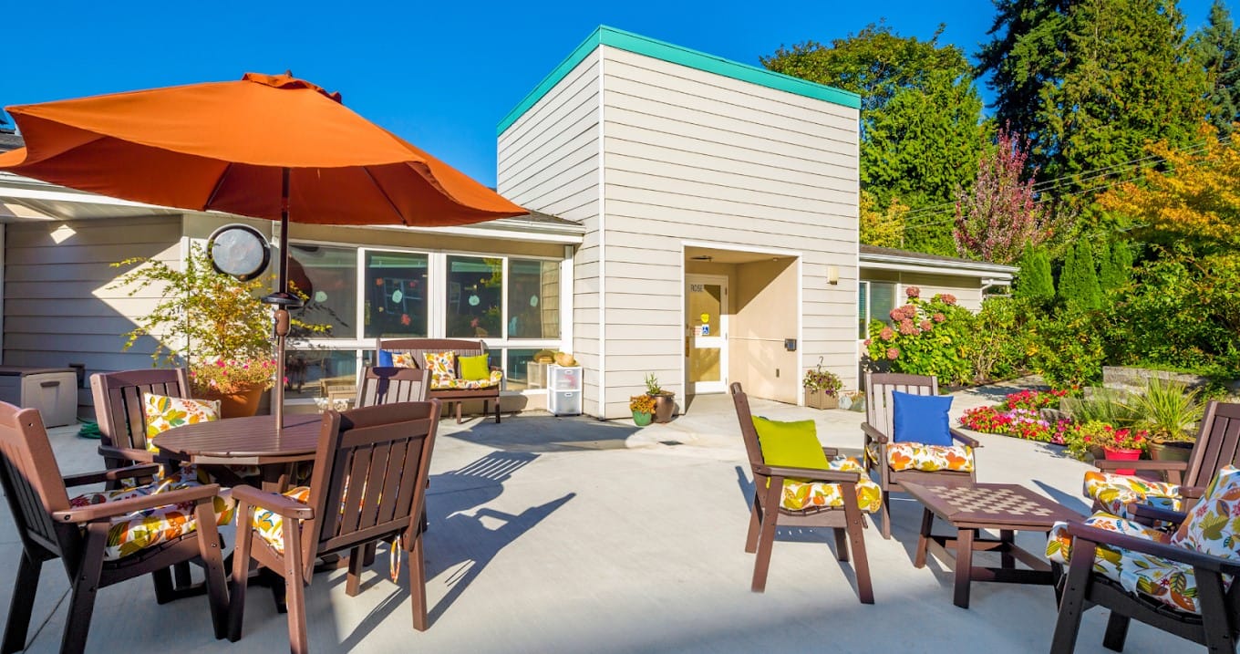 Outdoor seating area with colorful chairs and tables