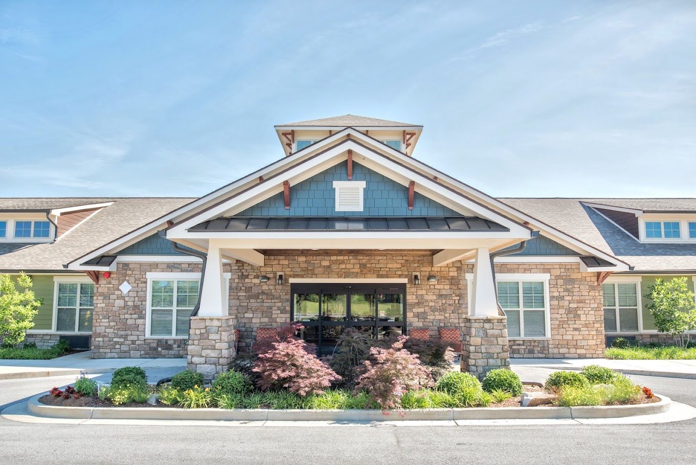 Entrance of Dominion Senior Living with landscaped area