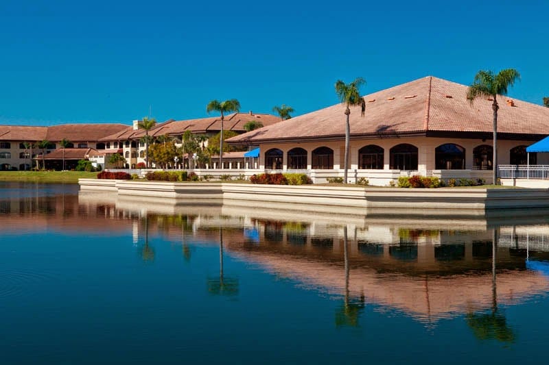 Exterior view of the facility reflecting on the water