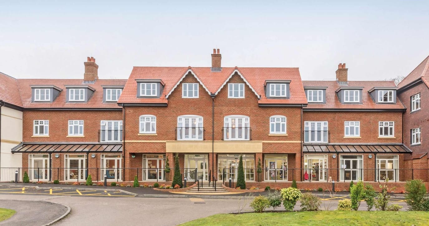 Exterior view of Elmbridge Village showcasing the building.