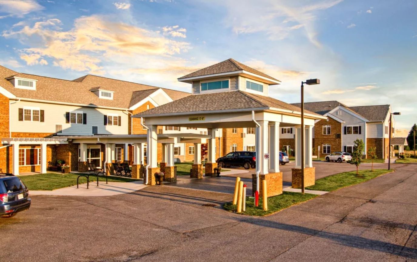 Exterior view of the facility entrance with parking area
