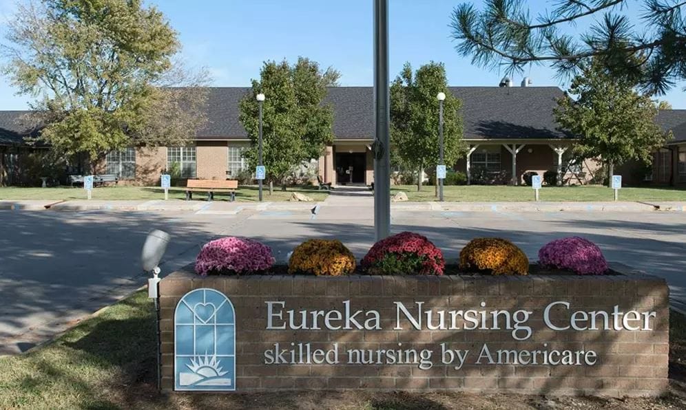 Exterior view of Eureka Nursing Center with flowers