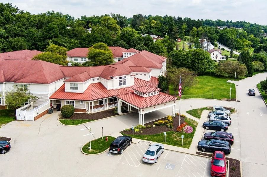 Aerial view of the facility entrance and parking area