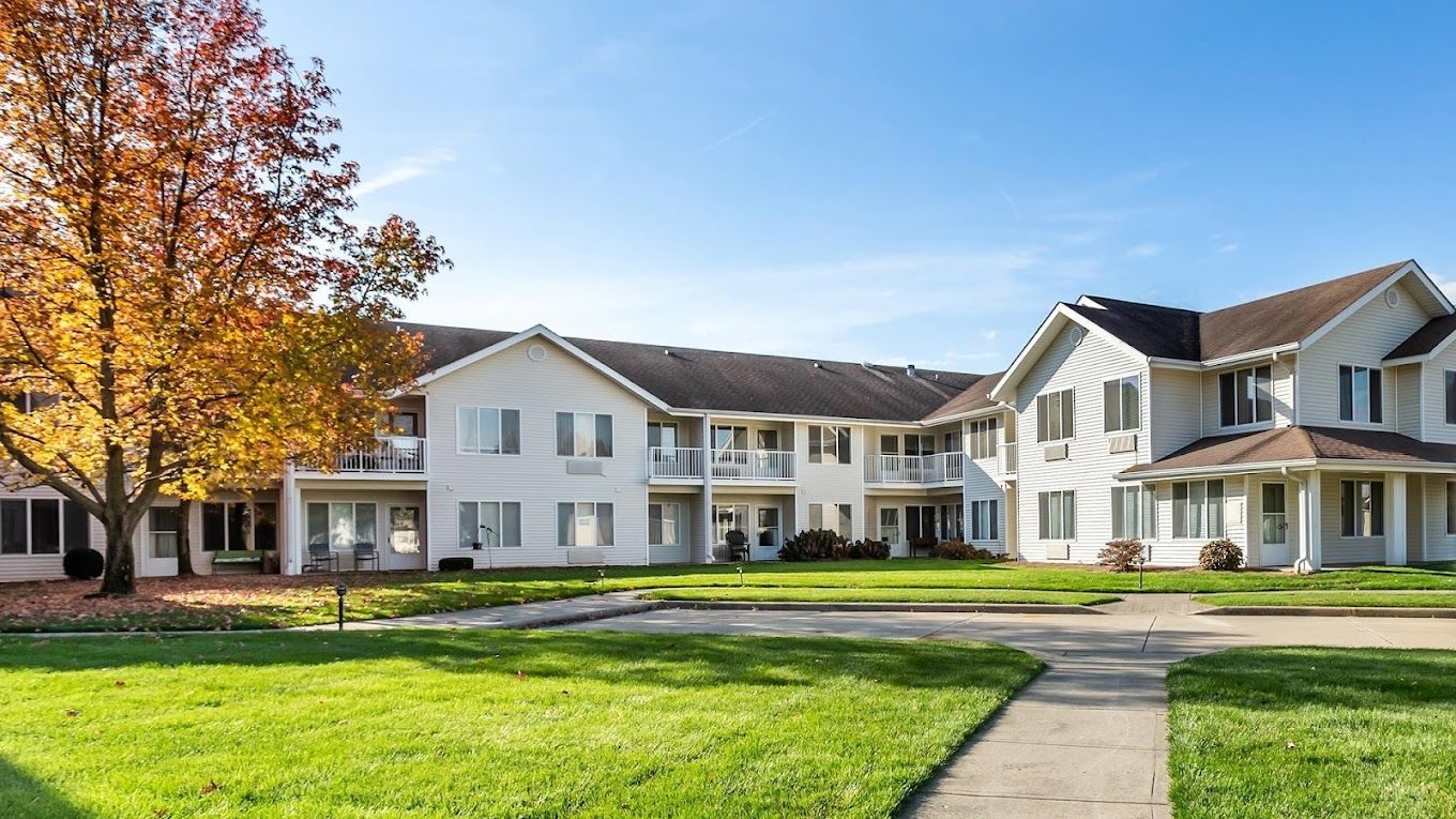 Exterior view of a senior living building with landscaping