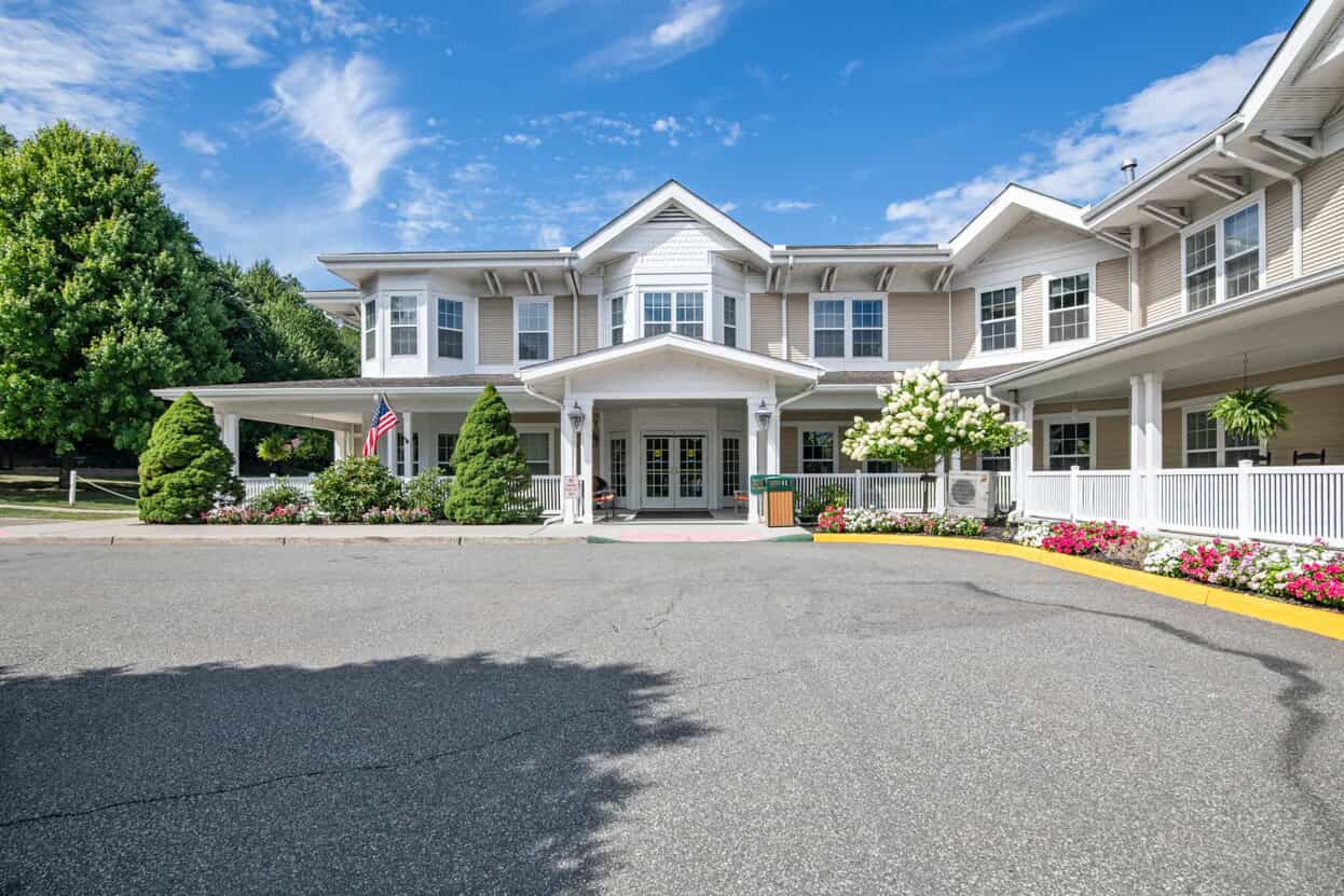 Exterior view of Longview facility entrance with gardens