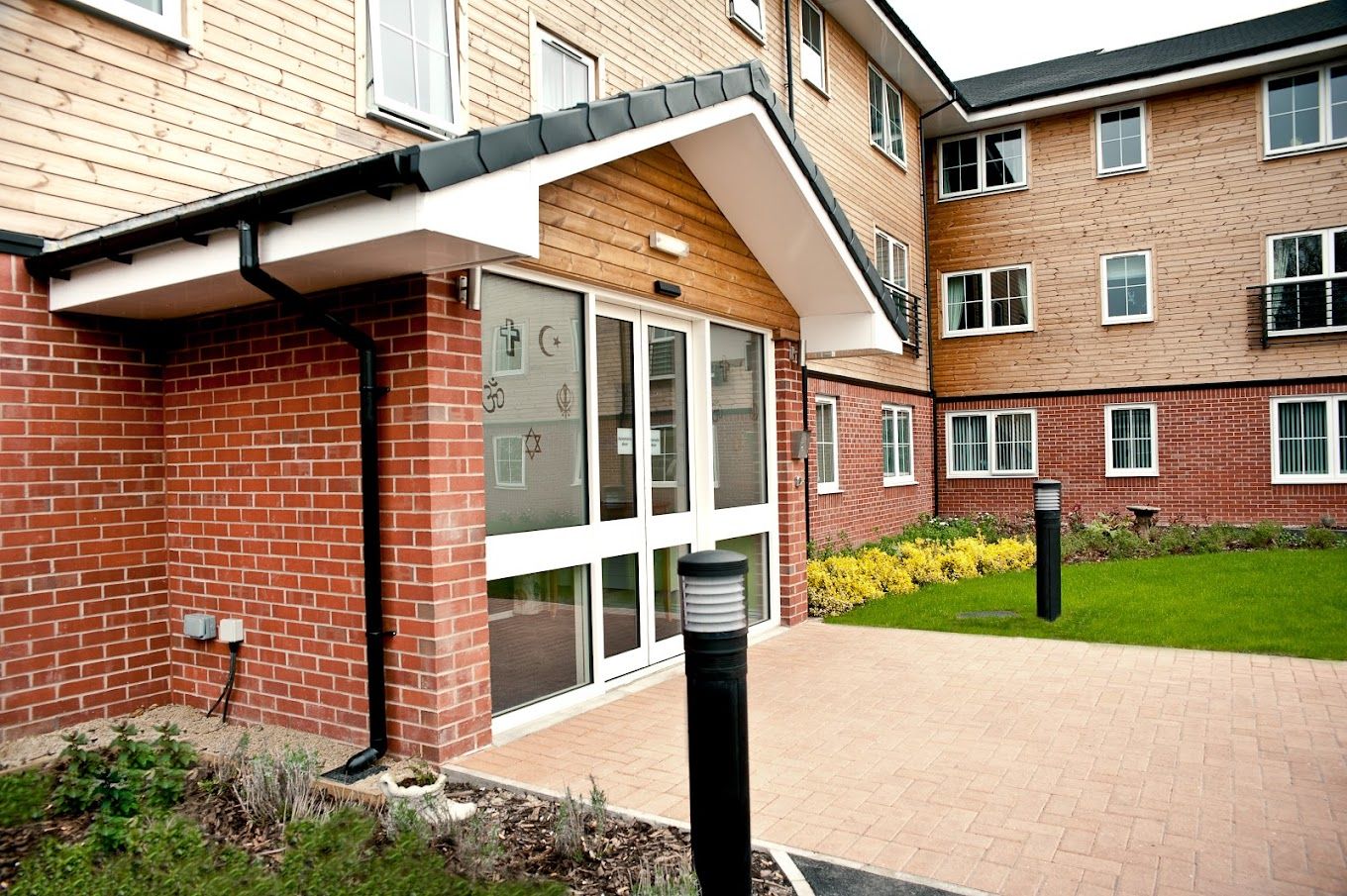 Exterior view of the facility entrance with landscaped area