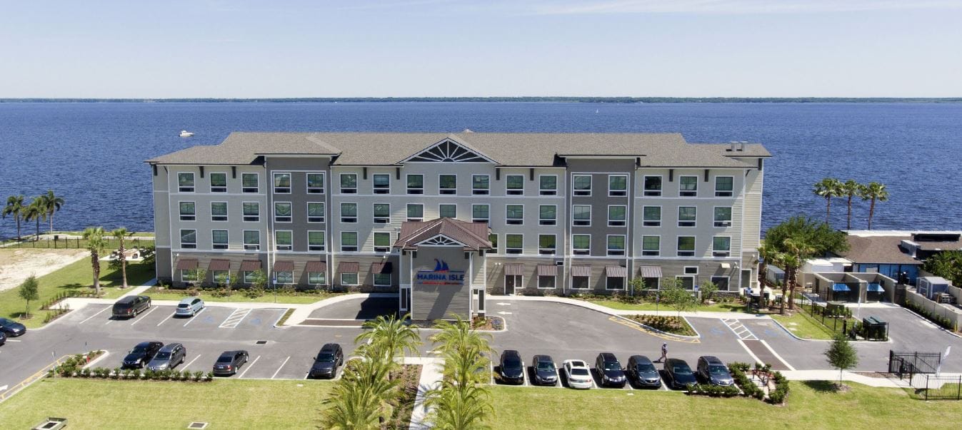 Aerial view of Marina Isle Waterfront Assisted Living facility by the water