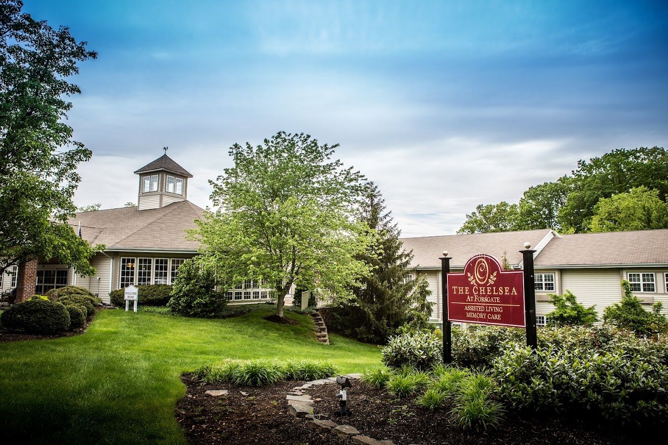 The exterior of a senior living facility with signage