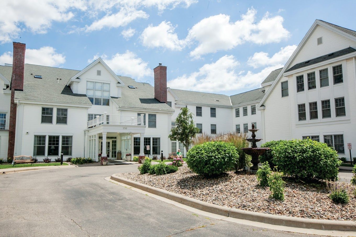Exterior view of New Perspective Highland Park with landscaped garden