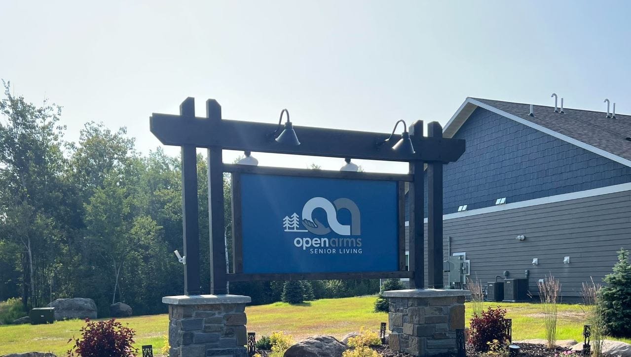 Outdoor sign for Open Arms Senior Living facility