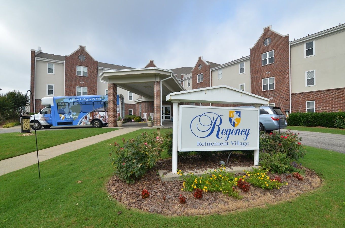 Exterior view of Regency Retirement Village with signage