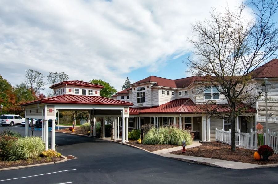 Exterior view of Richland Woods facility with parking and entrance