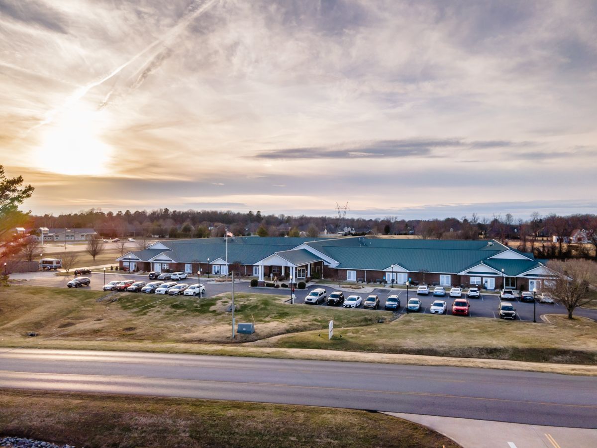 Aerial view of Rivercrest Place with sunset in the background