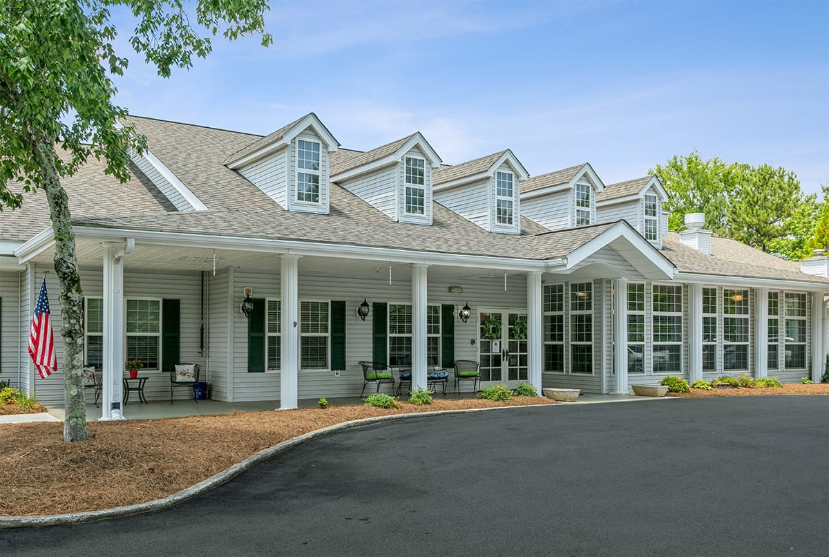 Exterior view of assisted living facility with landscaping