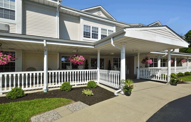 Exterior view of Shawnee Estates Senior Living with flowers