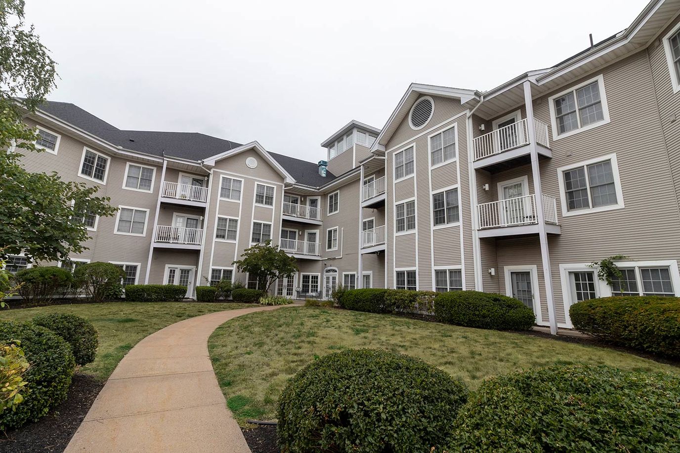 Exterior view of Southwick Village housing complex with garden