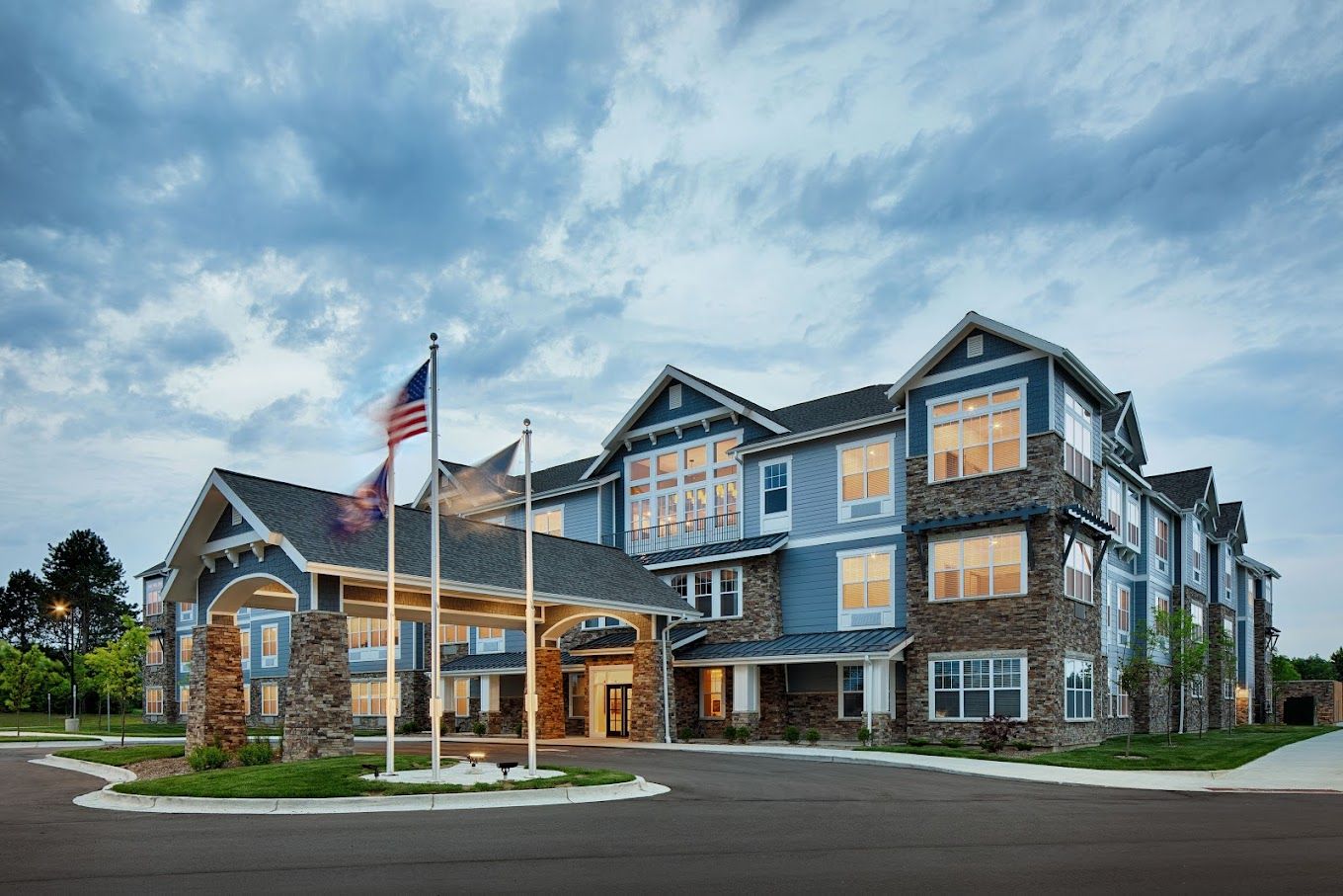 Exterior view of StoryPoint Northville with flags
