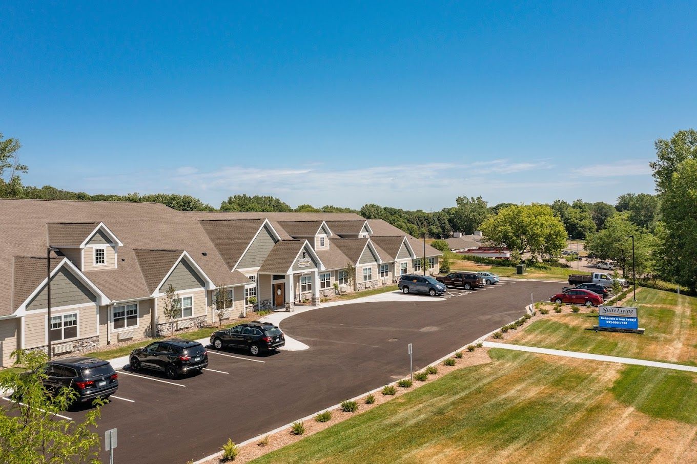 Exterior view of Suite Living with landscaped grounds