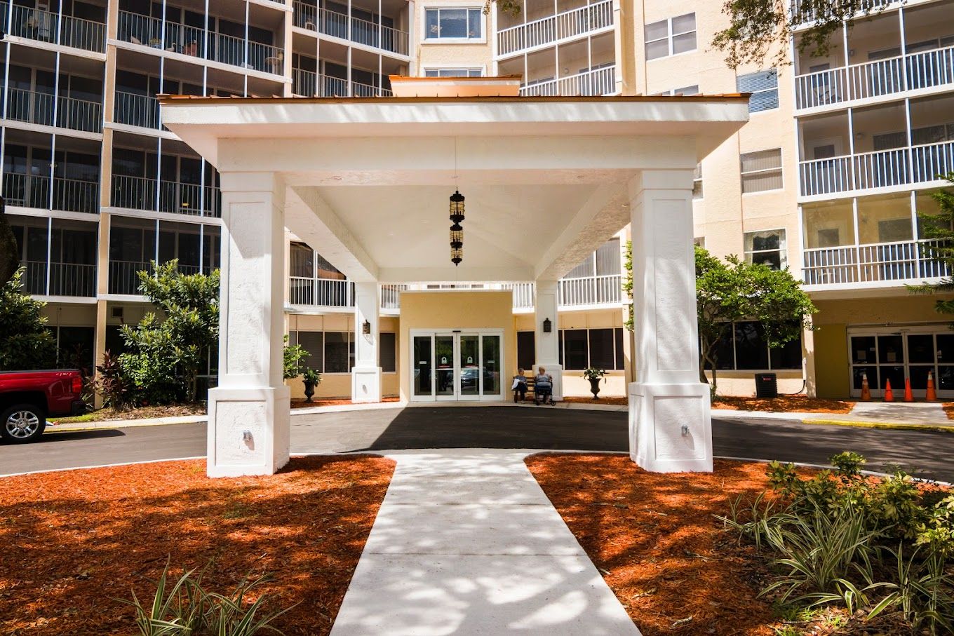 Entrance to Sun Towers Retirement Community with a covered walkway
