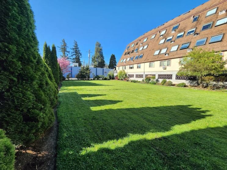 Well-maintained outdoor space with a view of the building