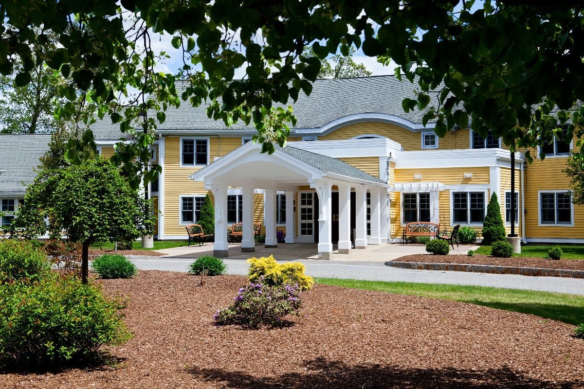 Exterior view of The Arbors of Bedford with landscaping