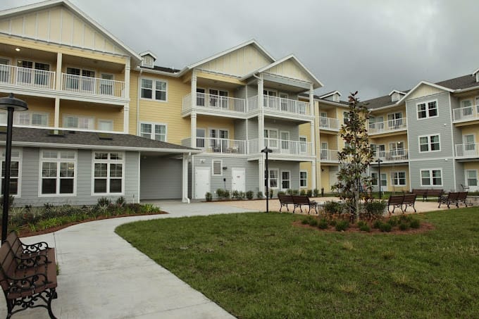 Exterior view of The Carriage House with landscaped gardens