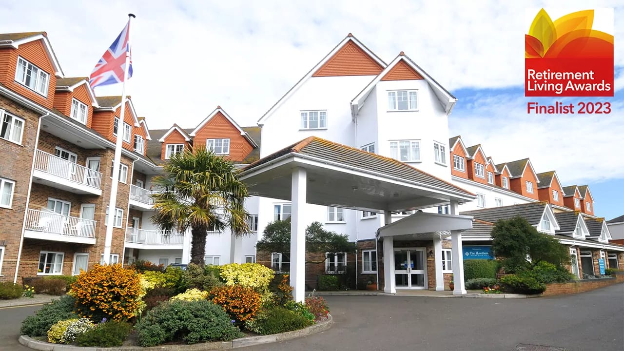 Exterior view of The Hawthorns Eastbourne with flowerbeds